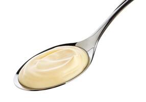 Sour cream in spoon isolated on white background with clipping path photo