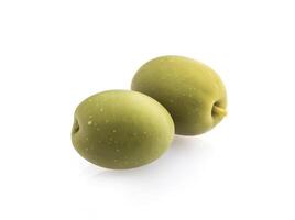 Two green olives isolated on white background. photo