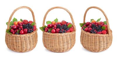 Fresh forest berries in basket isolated on white background with clipping path photo