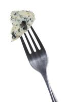 Danish blue cheese on fork isolated on white background with clipping path photo