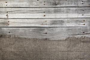 Burlap on old gray wooden background photo