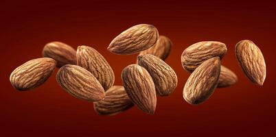 Flying almond isolated on red background photo