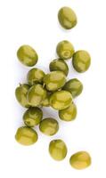 Heap of green olives isolated on white background. Top view photo