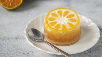 a dessert with orange slices on a plate photo