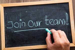 Join our team concept. Join Our Team words written on blackboard. photo