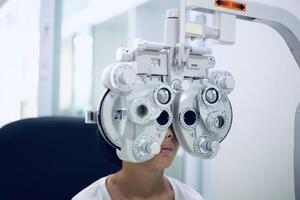 Child eye exam, kid eye test, Phoropter eye test photo