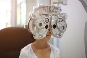 Child eye exam, kid eye test, Phoropter eye test photo