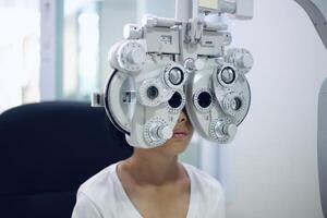 Child eye exam, kid eye test, Phoropter eye test photo