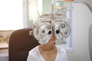 Child eye exam, kid eye test, Phoropter eye test photo