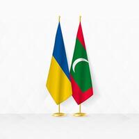 Ukraine and Maldives flags on flag stand, illustration for diplomacy and other meeting between Ukraine and Maldives. vector