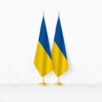 Ukraine and Ukraine flags on flag stand, illustration for diplomacy and other meeting between Ukraine and Ukraine. vector