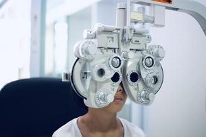 Child eye exam, kid eye test, Phoropter eye test photo