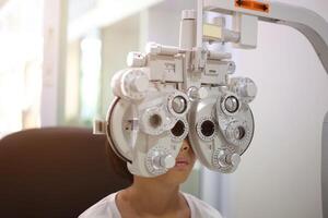 Child eye exam, kid eye test, Phoropter eye test photo