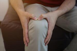 Knee massage to relieve pain, osteoarthritis, knee pain, knee inflammation photo