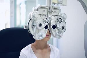 Child eye exam, kid eye test, Phoropter eye test photo