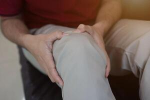 Knee massage to relieve pain, osteoarthritis, knee pain, knee inflammation photo