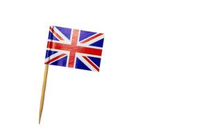 Top view of bamboo cocktail pick isolated on white background with clipping path. Bamboo toothpick with small paper union flag. photo