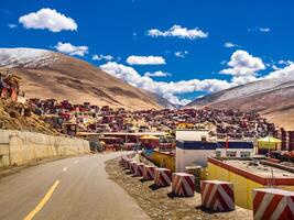 Shacks for buddhist monks and nuns at tibetan Yarchen Gar Monastery in Sichuan, China photo