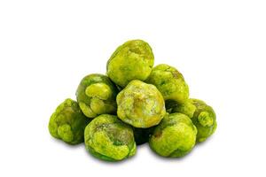 Closeup view pile of dried crispy spicy wasabi coated green peas isolated on white background with clipping path photo