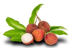 Bunch of ripe lychee and a half with green leaves isolated on white background with clipping path. photo