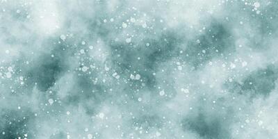 Beautiful winter background of snow floating into air randomly, light blue bokeh background for wallpaper, abstract sky blue cloudy watercolor background with bubbles and watercolor stains. photo