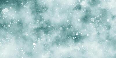 Beautiful winter background of snow floating into air randomly, light blue bokeh background for wallpaper, abstract sky blue cloudy watercolor background with bubbles and watercolor stains. photo