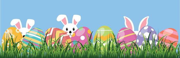 Rabbits in green grass with Easter eggs. Vector graphics