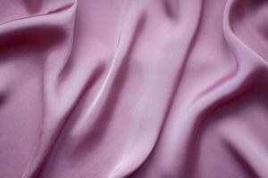 Pink silk or satin background. Elegant, delicate and beautiful texture. photo