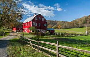 AI generated Red barn and green field in the countryside photo