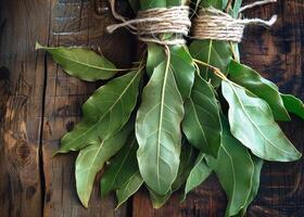 AI generated Fresh bay leaves on wooden background photo