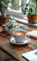 AI generated Cup of coffee stands on wooden table near laptop and flower photo