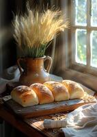 AI generated Freshly baked homemade bread rolls and wheat ears in vase on wooden table in the rays of the morning sun photo