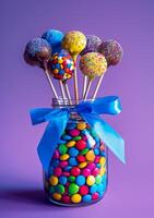 AI generated Colorful chocolate lollipops and candies in glass jar with blue ribbon on purple background photo