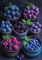 AI generated Blueberries raspberries blackberries and blueberries in bowls on dark background photo