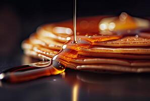 AI generated Pancakes and maple syrup on black background photo