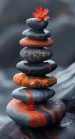 AI generated Zen stones. Red flower on the top of zen pyramid photo