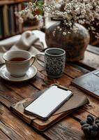 AI generated Cup of tea smartphone and notebook on wooden table photo