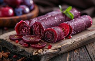 AI generated Handmade fruit pastilles with plums and prunes on wooden background photo