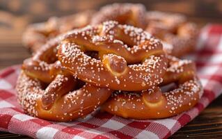 ai generado un pila de dorado marrón pretzels, generosamente rociado con blanco azúcar cristales foto