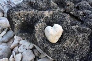 Yin Yang Black and White with a Heart Shaped Stone photo