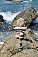 Meditative Stack of Stones Balancing on a Rock photo