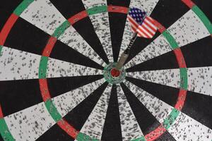 Dart Board with a Dart in the Center photo