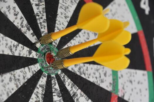 Amazong Close Up of Three Darts in a Dartboard photo