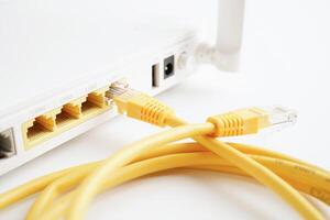 Ethernet cable with wireless router connect to internet service provider network. photo