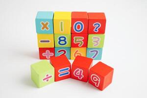 Number wood block cubes for learning Mathematic, education math concept. photo