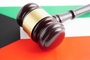 Kuwait, Legal, justice and agreement, wooden court gavel on flag. photo