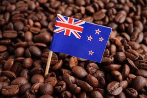 New Zealand flag on coffee beans, shopping online for export or import food product. photo