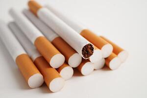 Cigarette, roll tobacco in paper with filter tube, No smoking concept. photo