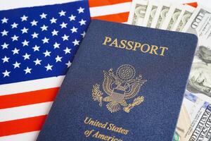 US passport with USA dollar money, American citizen in United States of America. photo