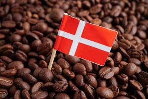 Denmark flag on coffee beans, shopping online for export or import food product. photo